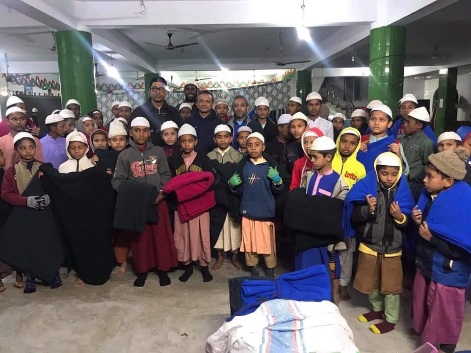 Distribution of winter clothes in orphanages
